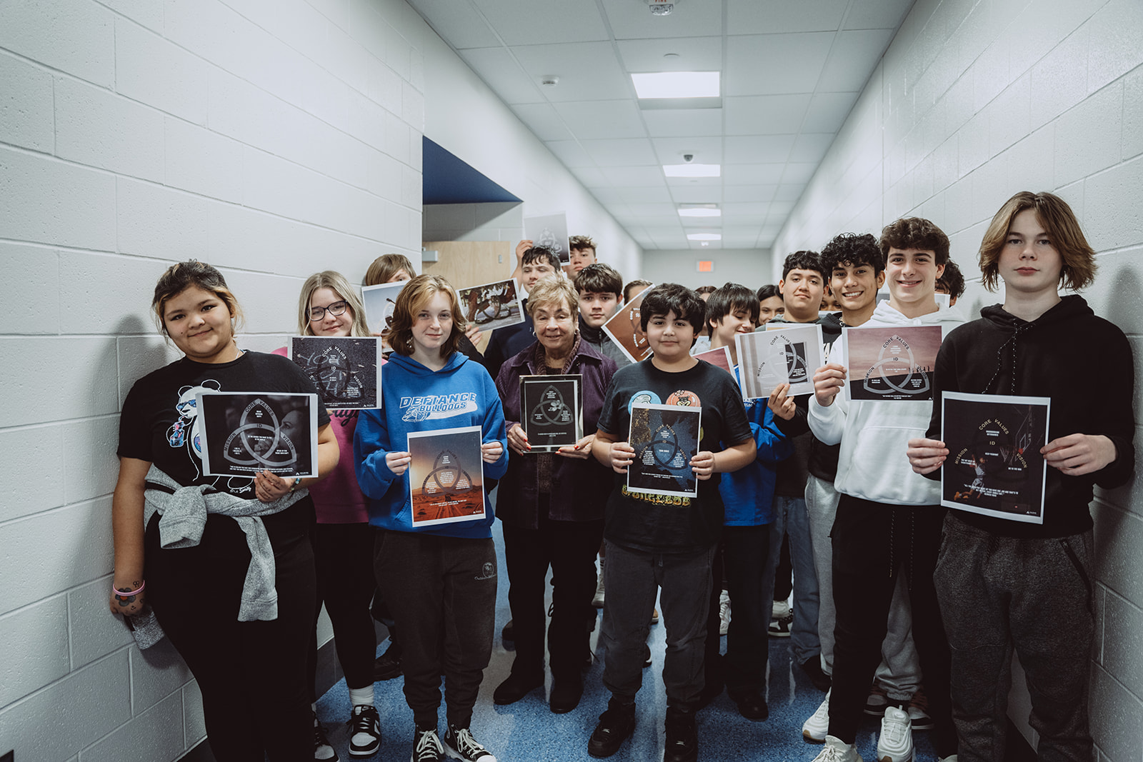 Students proudly holding their Mission Portrait™s